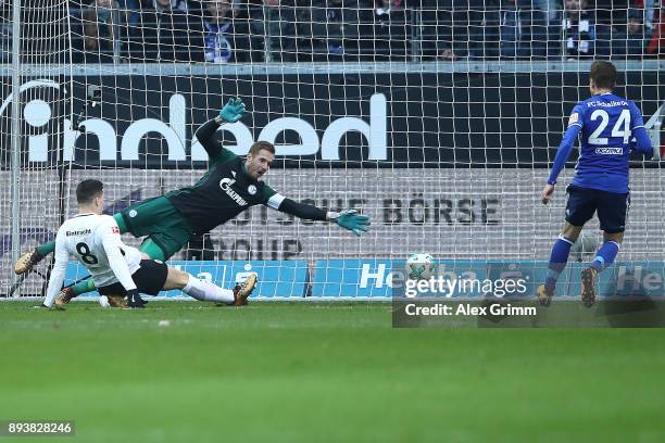 Luka Jovic of Frankfurt scores a goal past goalkeeper Ralf Faehrmann of Schalke to make it 1:0 during the Bundesliga match between Eintracht...