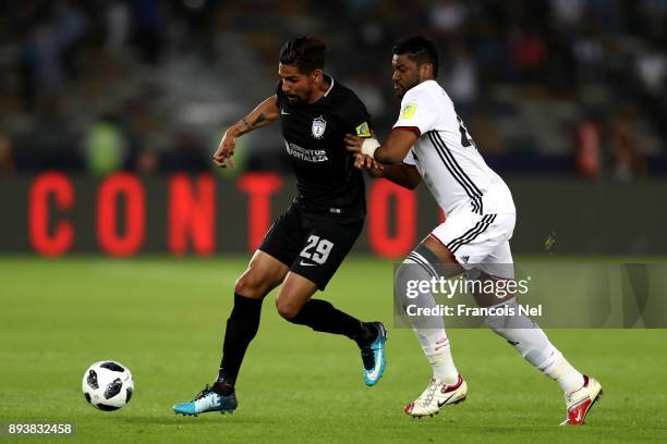 Franco Jara of CF Pachuca is challenged by Fares Juma of Al Jazira during the FIFA Club World Cup UAE 2017 third place play off match between Al...