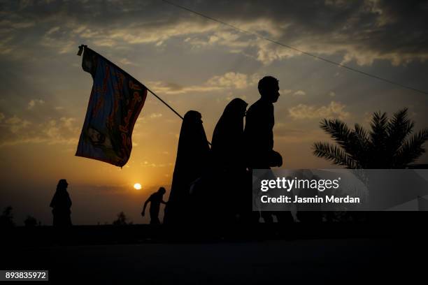 groups of people walking at sunset - arbaeen stock pictures, royalty-free photos & images