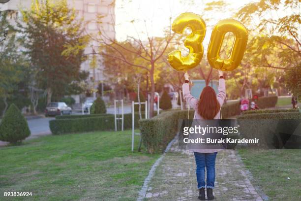 young woman celebrates a thirty years birthday - 30 34 years stock-fotos und bilder