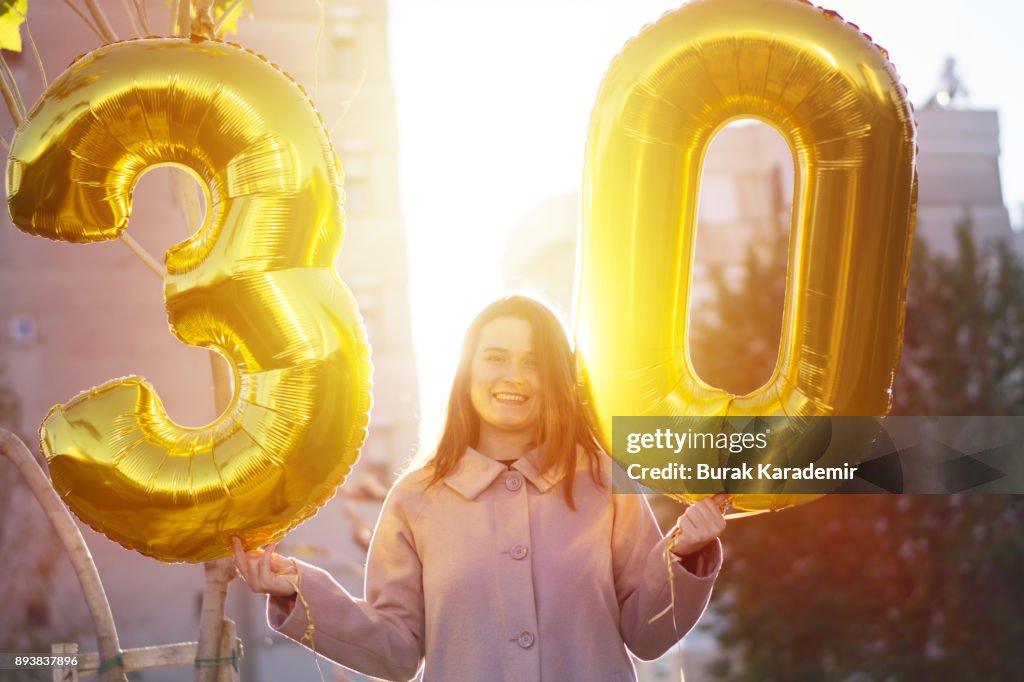 Young woman celebrates a thirty years birthday