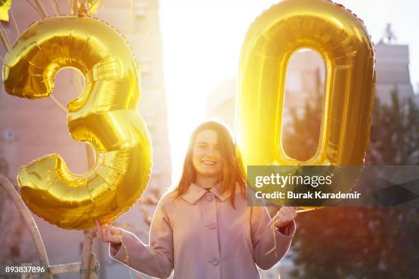 young woman celebrates a thirty years birthday - 30 34 years foto e immagini stock