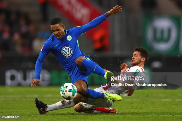 Salih Ozcan of FC Koeln tackles Daniel Didavi of Wolfsburg during the Bundesliga match between 1. FC Koeln and VfL Wolfsburg at RheinEnergieStadion...