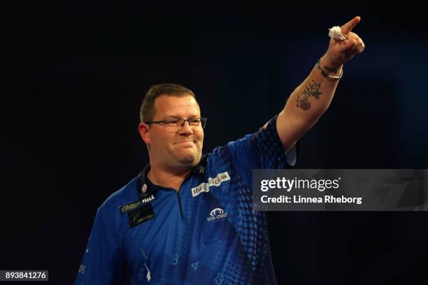 Steve West of England celebrates after winning his match against Benito van de Pas of Netherlands during day three of the 2018 William Hill PDC World...