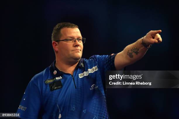 Steve West of England celebrates after winning his match against Benito van de Pas of Netherlands during day three of the 2018 William Hill PDC World...