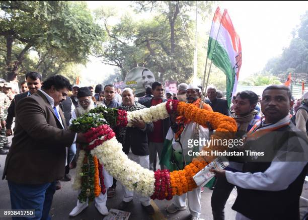 Congress supporters and workers celebrating during newly elected Congress president Rahul Gandhi's elevation to the top post in a grand elevation...