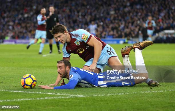 Glenn Murray of Brighton and Hove Albion is tackled by James Tarkowski of Burnley which leads to a penalty during the Premier League match between...
