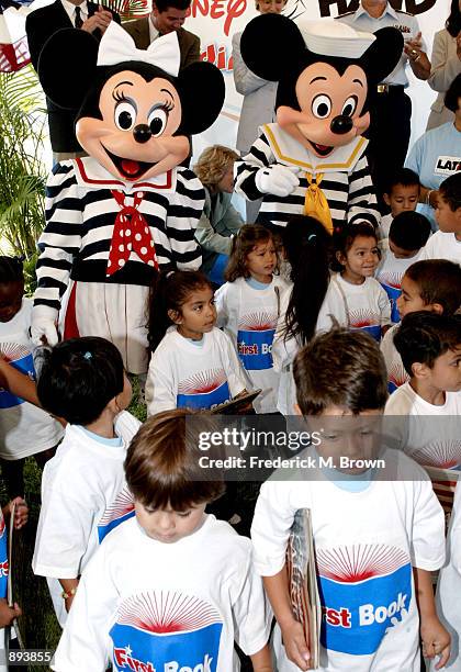 Mickey Mouse and Minnie Mouse attend The Walt Disney Company's donation of one million books to First Book, a non profit organization dedicated to...