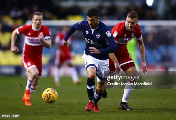 Lee Gregory of Millwall takes the ball past Ben Gibson of Middlesbrough during the Sky Bet Championship match between Millwall and Middlesbrough at...