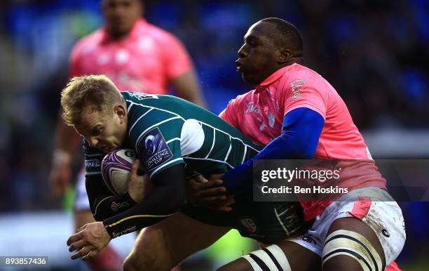 Scott Steele of London Irish dives under pressure from Sekou Macalou of Stade Francais to score a try during the European Rugby Challenge Cup match...