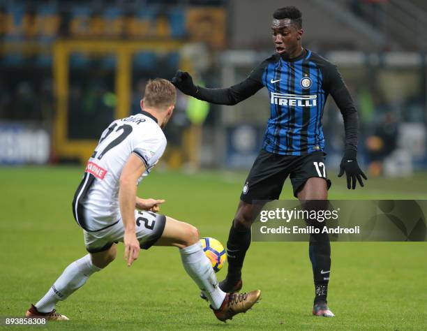 Yann Karamoh of FC Internazionale Milano is challenged by Silvan Widmer of Udinese Calcio during the Serie A match between FC Internazionale and...