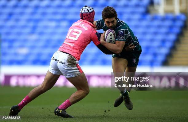 Tom Fowlie of London Irish is tackled by Tho Millet of Stade Francais during the European Rugby Challenge Cup match between London Irish and Stade...