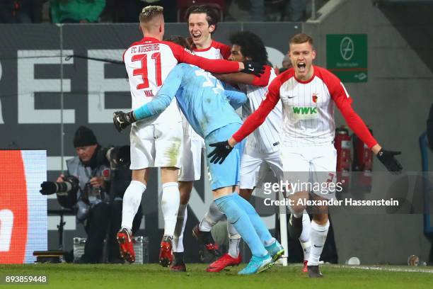 Alfred Finnbogason of Augsburg celebrates scoring teh 3rd team goal during the Bundesliga match between FC Augsburg and Sport-Club Freiburg at...