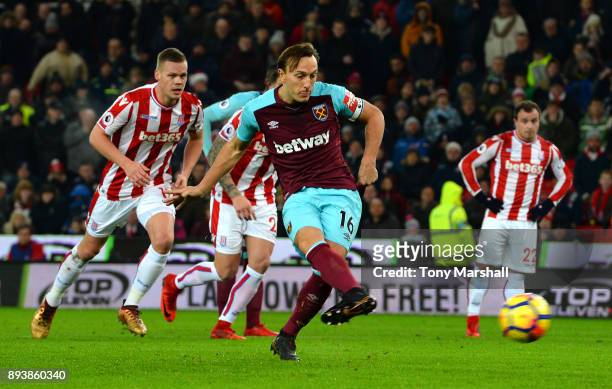 Mark Noble of West Ham United scores his sides first goal from the penalty spot during the Premier League match between Stoke City and West Ham...