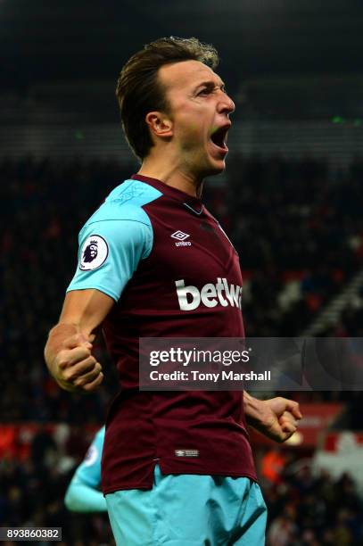 Mark Noble of West Ham United celebrates after scoring his sides first goal during the Premier League match between Stoke City and West Ham United at...