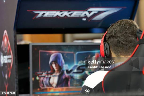 An e-sport player competes the video game Tekken 7 during an e-sports tournament organized by FDJ at "Le Carreau du Temple" on December 16, 2017 in...