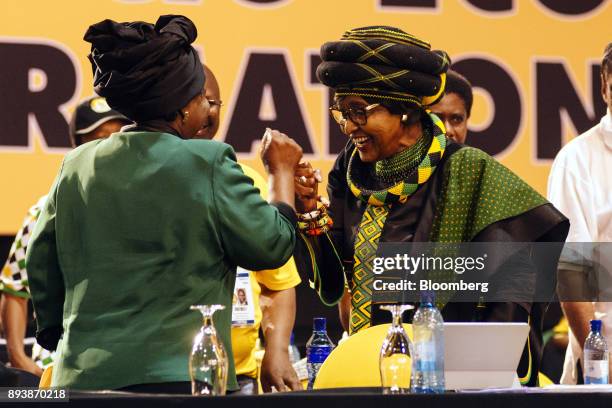 Nkosazana Dlamini-Zuma, presidential candidate of the African National Congress party , left, greets Winnie Madikizela-Mandela, wife of former...