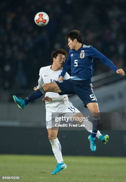 Shintaro ££5 of Japan and Yeom kihun of South Korea in action during the EAFF E-1 Men's Football Championship between Japan and South Korea at...