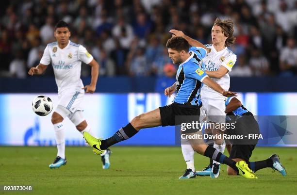 Walter Kannemann of Gremio is challenged by Luka Modric of Real Madrid during the FIFA Club World Cup UAE 2017 Final between Gremio and Real Madrid...