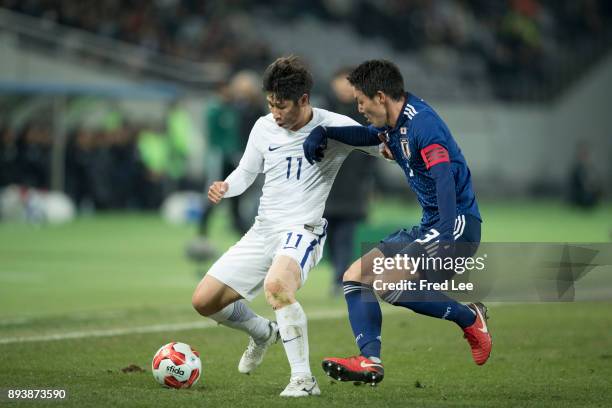 Gen of Japan and Lee Keunho of South Korea in action during the EAFF E-1 Men's Football Championship between Japan and South Korea at Ajinomoto...