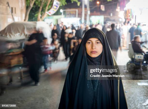 muslim woman portrait on street - iraqi woman stock pictures, royalty-free photos & images