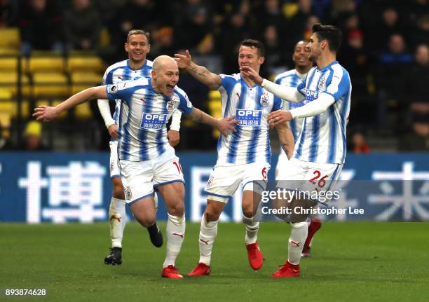 Aaron Mooy of Huddersfield Town celebrates after scoring his sides second goal with his team mates during the Premier League match between Watford...