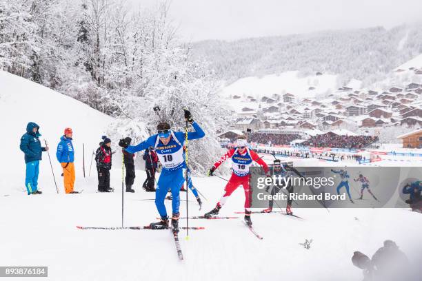 26th place Tim Burke of the USA and 27th place Scott Gow of Canada compete during the IBU Biathlon World Cup Men's Pursuit on December 16, 2017 in Le...