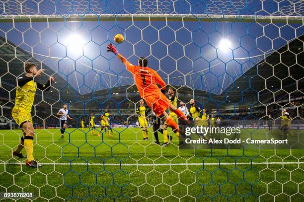 Burton Albion's Stephen Bywater reaches out to stop Bolton Wanderers' David Wheater's header during the Sky Bet Championship match between Bolton...