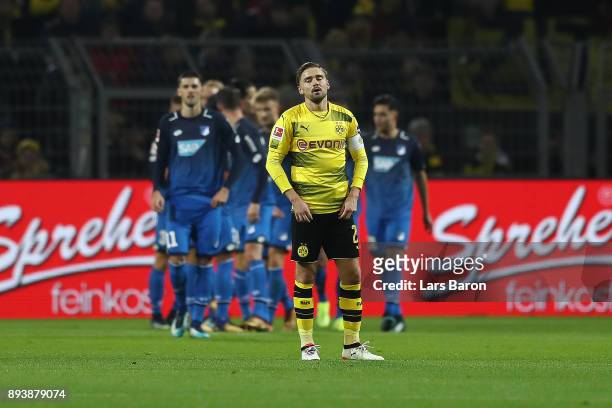 Marcel Schmelzer of Dortmund looks dejected after Hoffenheim scored a goal to make it 0:1 during the Bundesliga match between Borussia Dortmund and...