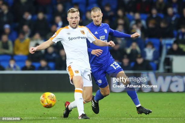 Seb Larsson of Hull City is marked by Anthony Pilkington of Cardiff City during the Sky Bet Championship match between Cardiff City and Hull City at...