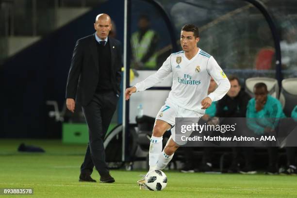 Real Madrid Head Coach / Manager Zinedine Zidane watches Cristiano Ronaldo of Real Madrid during the FIFA Club World Cup UAE 2017 final match between...