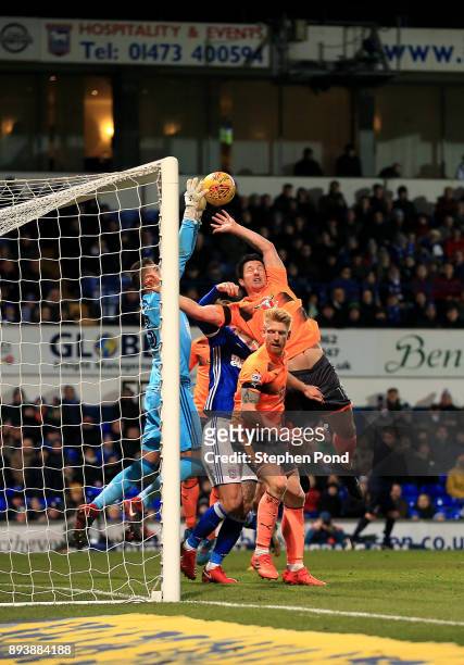 Yann Kermorgant of Reading and Bartosz Bialkowski of Ipswich Town compete for the ball during the Sky Bet Championship match between Ipswich Town and...