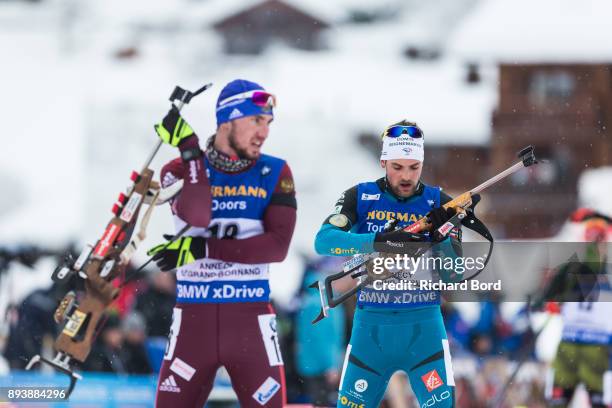 4th place Alexander Loginov of Russia and 6th place Simon Desthieux of France compete during the IBU Biathlon World Cup Men's Pursuit on December 16,...