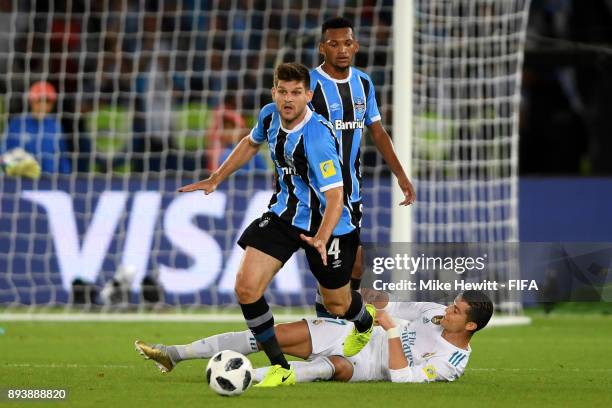 Cristiano Ronaldo of Real Madrid attempts to tackle Walter Kannemann of Gremio during the FIFA Club World Cup UAE 2017 Final between Gremio and Real...