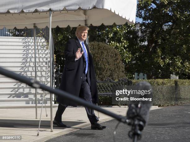 President Donald Trump arrives to speak to members of the media before departing for Camp David on the South Lawn of the White House in Washington,...