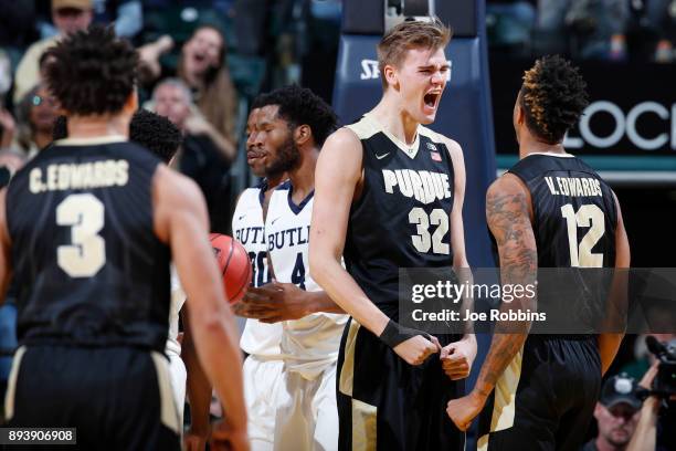 Matt Haarms and Vincent Edwards of the Purdue Boilermakers celebrate against the Butler Bulldogs in the second half of the Crossroads Classic at...