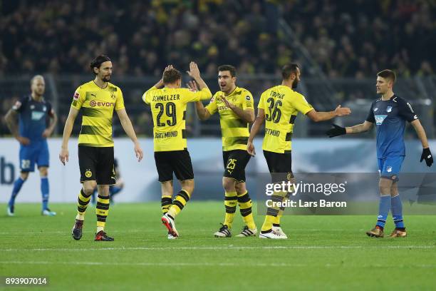 Neven Subotic of Dortmund, Marcel Schmelzer of Dortmund, Sokratis Papastathopoulos of Dortmund celebrate, as Oemer Toprak of Dortmund shakes hands...
