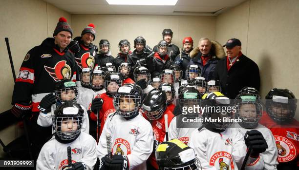 Chris Phillips, Pascal Leclare and Guy Lafleur pose for a photo with Little Sens prior to Learn to Play on Parliament Hill on December 16, 2017 in...