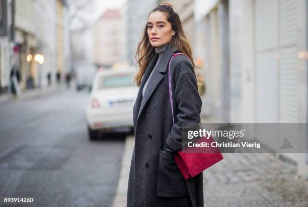 Anna Sharypova wearing red Agneel bag, dark grey COS wool coat, Adidas sneaker, boyfriend denim jeans &other stories, top Uniqlo, on December 16,...