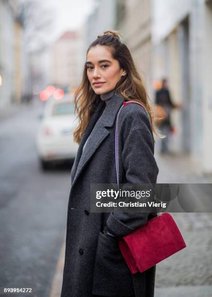 Anna Sharypova wearing red Agneel bag, dark grey COS wool coat, Adidas sneaker, boyfriend denim jeans &other stories, top Uniqlo, on December 16,...