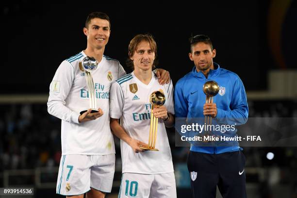 Cristiano Ronaldo of Real Madrid, Luka Modric of Real Madrid and Jonathan Urretaviscaya of CF Pachuca pose with there adidas Golden Ball trophys...