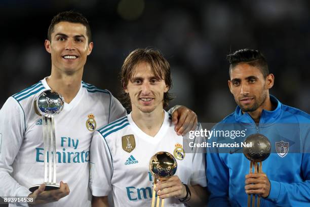 Cristiano Ronaldo of Real Madrid, Luka Modric of Real Madrid and Jonathan Urretaviscaya of CF Pachuca pose with there adidas Golden Ball trophys...