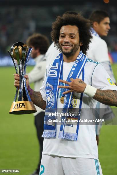 Marcelo of Real Madrid celebrates with the trophy at the end of the FIFA Club World Cup UAE 2017 final match between Gremio and Real Madrid CF at...