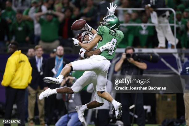 Marcus Jones of the Troy Trojans breaks up a pass intended for Rico Bussey Jr. #8 of the North Texas Mean Green during the first half of the R+L...