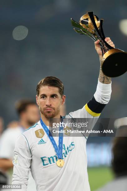 Sergio Ramos of Real Madrid celebrates with the trophy at the end of the FIFA Club World Cup UAE 2017 final match between Gremio and Real Madrid CF...