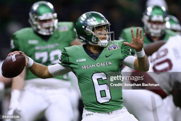 Mason Fine of the North Texas Mean Green throws the ball during the first half of the R+L Carriers New Orleans Bowl against the Troy Trojans at the...