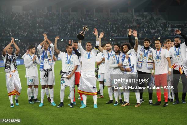 Sergio Ramos of Real Madrid celebrates with the trophy and his team-mates at the end of the FIFA Club World Cup UAE 2017 final match between Gremio...