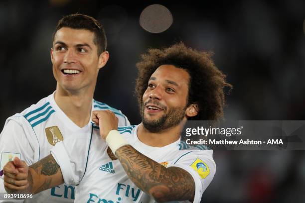 Cristiano Ronaldo and Marcelo of Real Madrid celebrate at the end of the FIFA Club World Cup UAE 2017 final match between Gremio and Real Madrid CF...