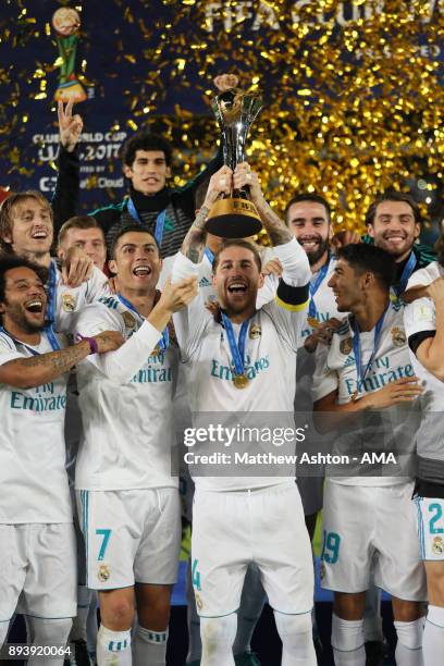 Sergio Ramos of Real Madrid lifts the trophy with his team-mates at the end of the FIFA Club World Cup UAE 2017 final match between Gremio and Real...