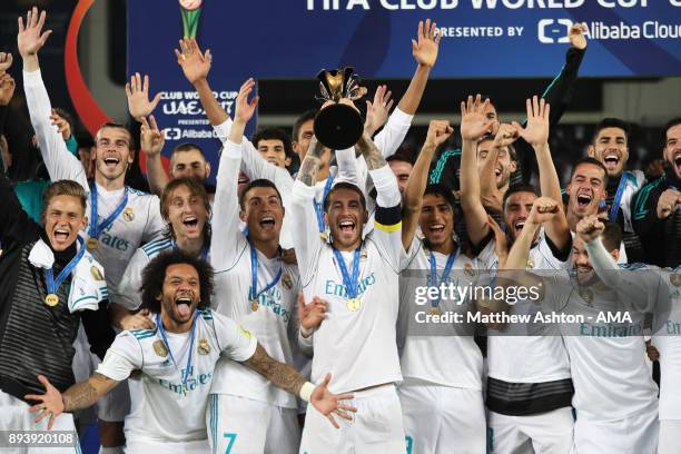 Sergio Ramos of Real Madrid lifts the trophy with his team-mates at the end of the FIFA Club World Cup UAE 2017 final match between Gremio and Real...